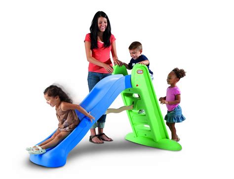 Kids taking turns on a sliding board