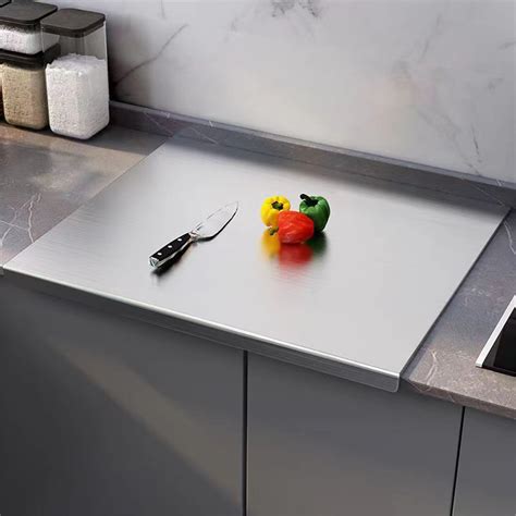 Metal cutting board with rolling pin and dough