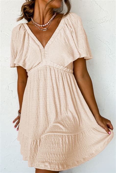 Minimalist beige dress with ballet flats and simple necklace